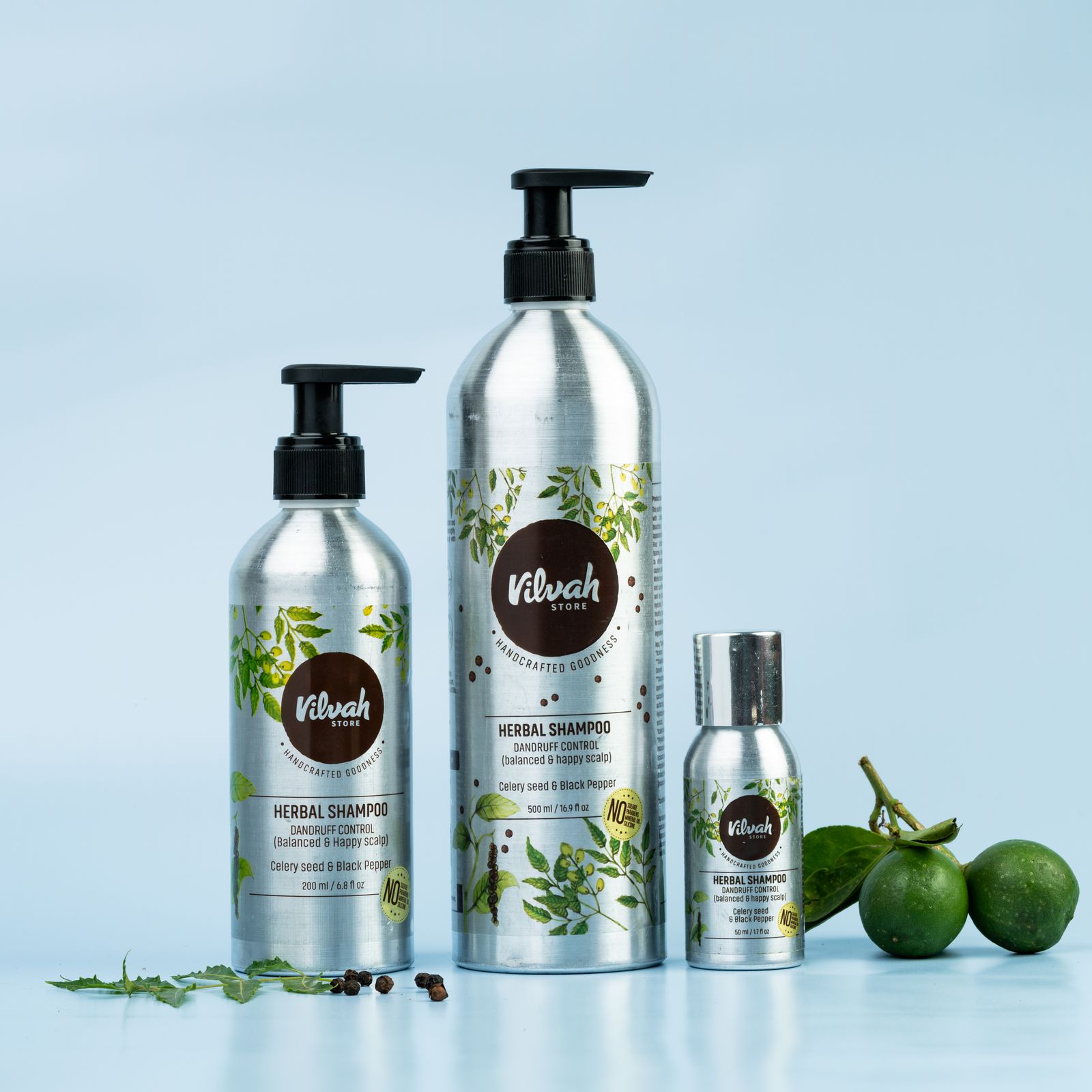Shampoo and conditioner bottles with fresh limes