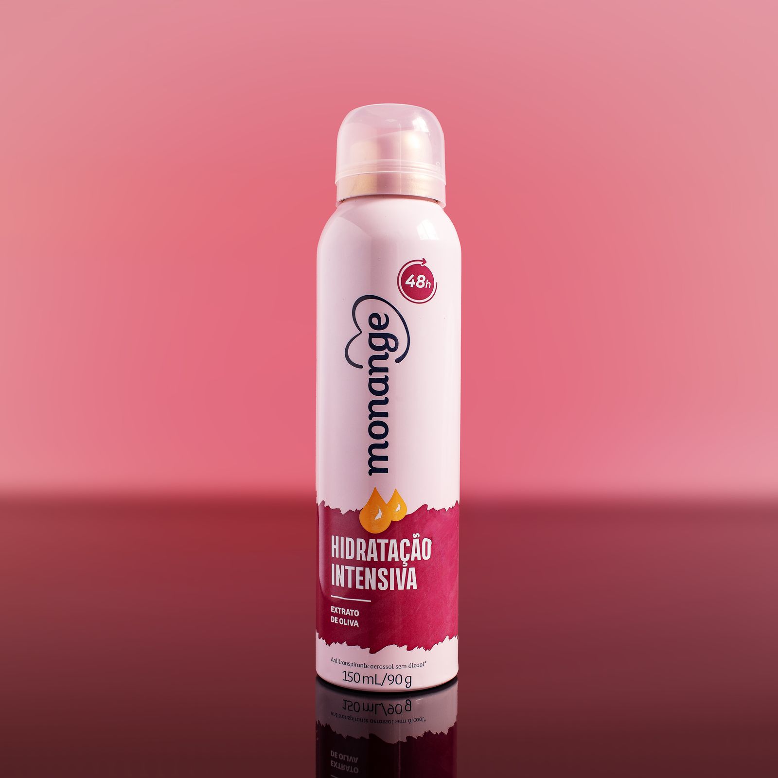 A spray bottle against a pink backdrop